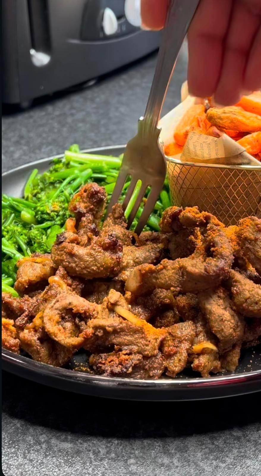 West African-style spiced beef strips with steamed broccolini and sweet potato fries